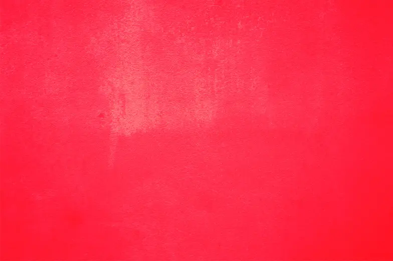 Eine leuchtend rote Fläche mit einer gleichmäßigen Farbverteilung, weist an einigen Stellen leichte Unregelmäßigkeiten und Texturen auf.