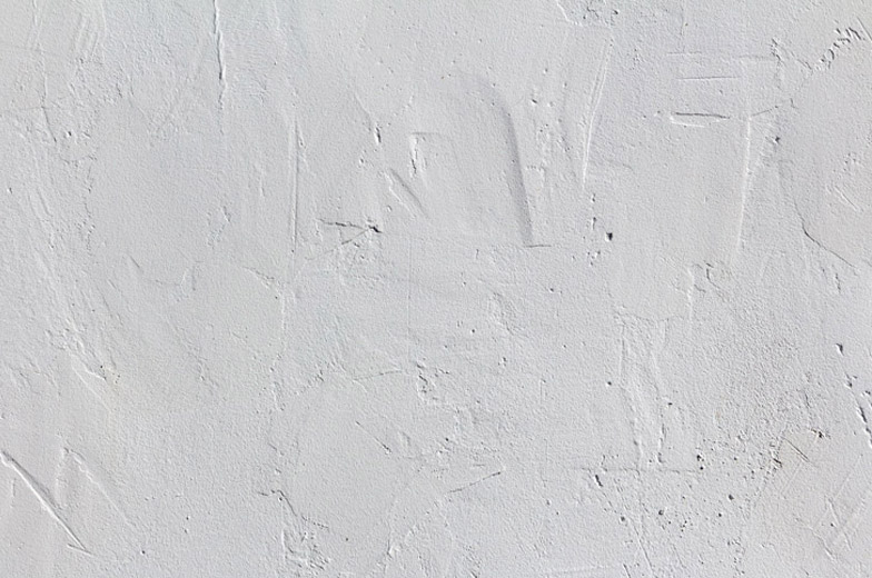 Lunken im Putz einer Wand nach Malerarbeiten